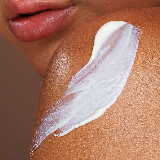 Close-up of SPF 30 Natural Body Sunscreen swatched on skin, showing its smooth and hydrating texture.