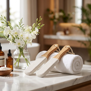 Bamboo foot smoothers styled in a bathroom wellness setting with towels and oils