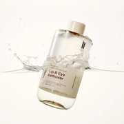 Frudia Reproust Lip and Eye Remover bi phase makeup remover shown in water splash