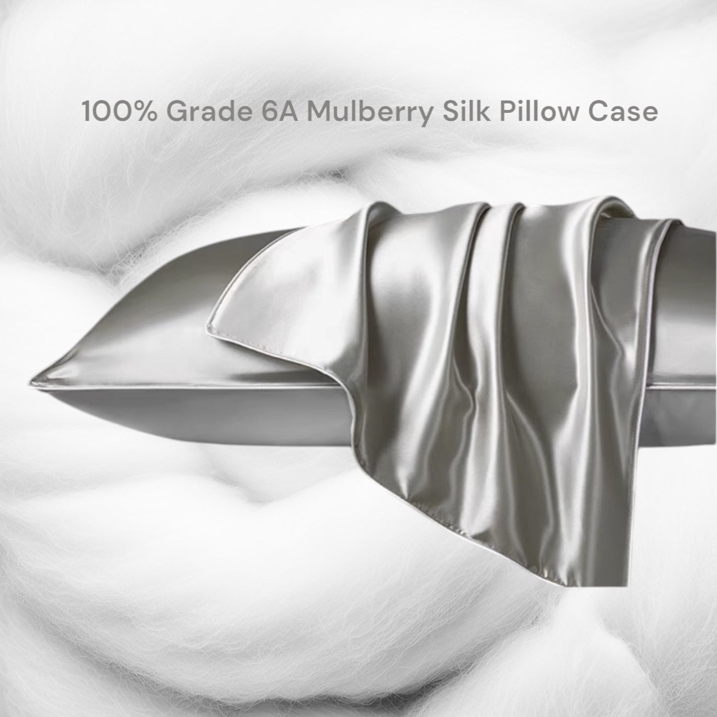 A grey silk pillowcase draped over the pillow with a soft white background