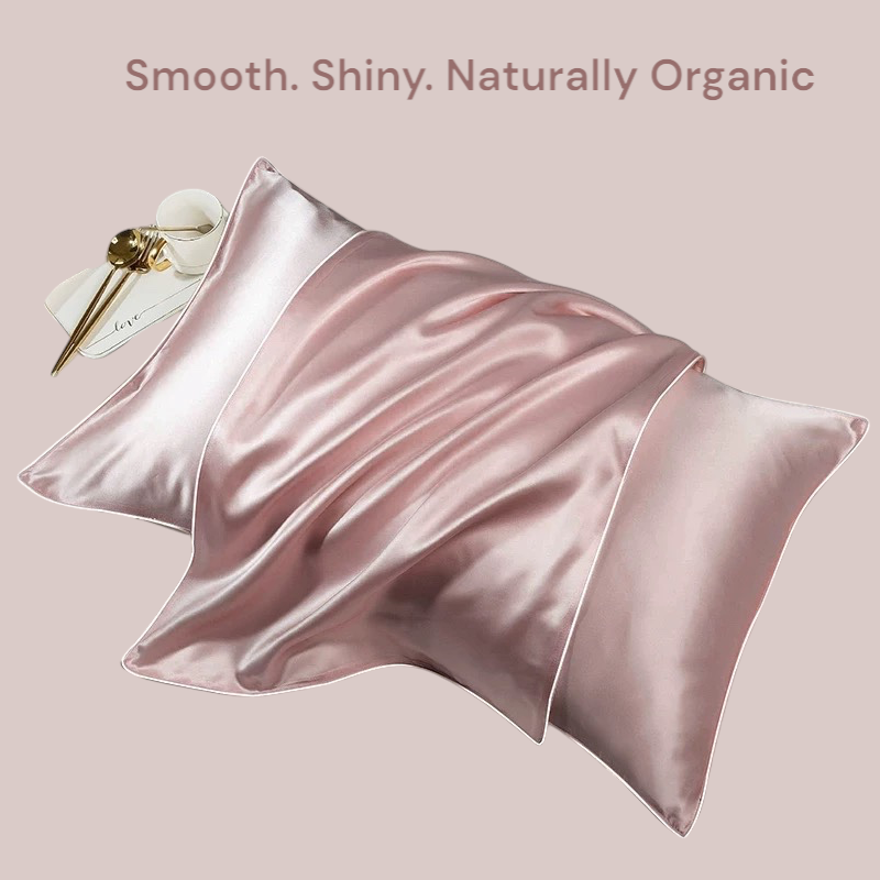 Pink mulberry silk pillowcase flatlay with smooth texture and natural light