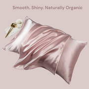 Pink mulberry silk pillowcase flatlay with smooth texture and natural light